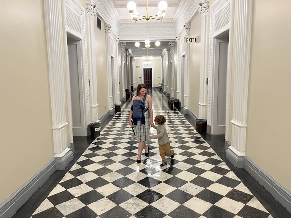 Ogorzalek in the middle of the White House hallway with her sons