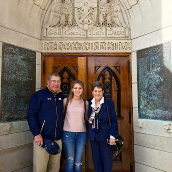 Blais with her grand
parents in front of the God Country Notre Dame Door at the Basilica